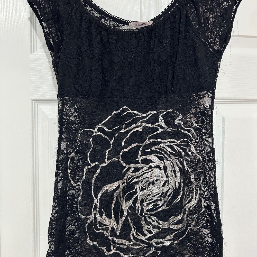 Timing size medium black lace shirt.